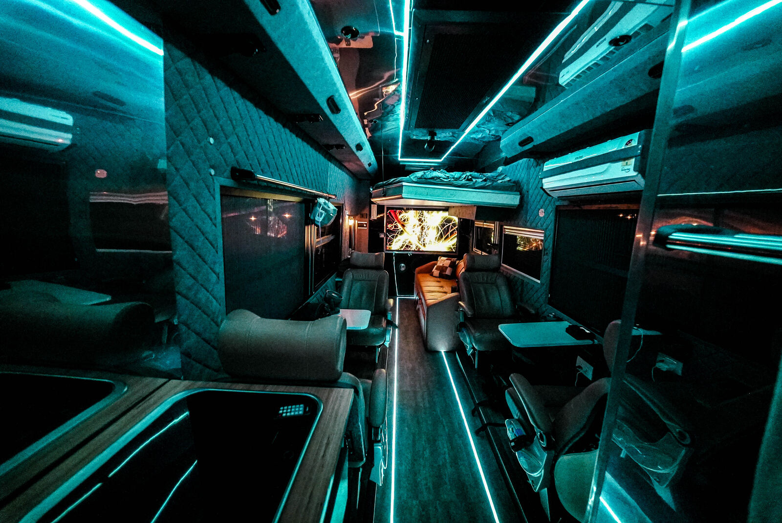 Black Caravan lounge with ambient lighting