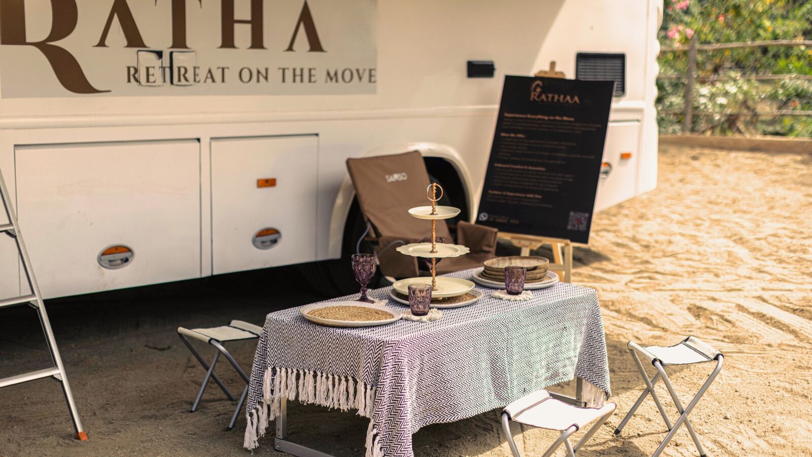 Curated dining setup beside the White Caravan